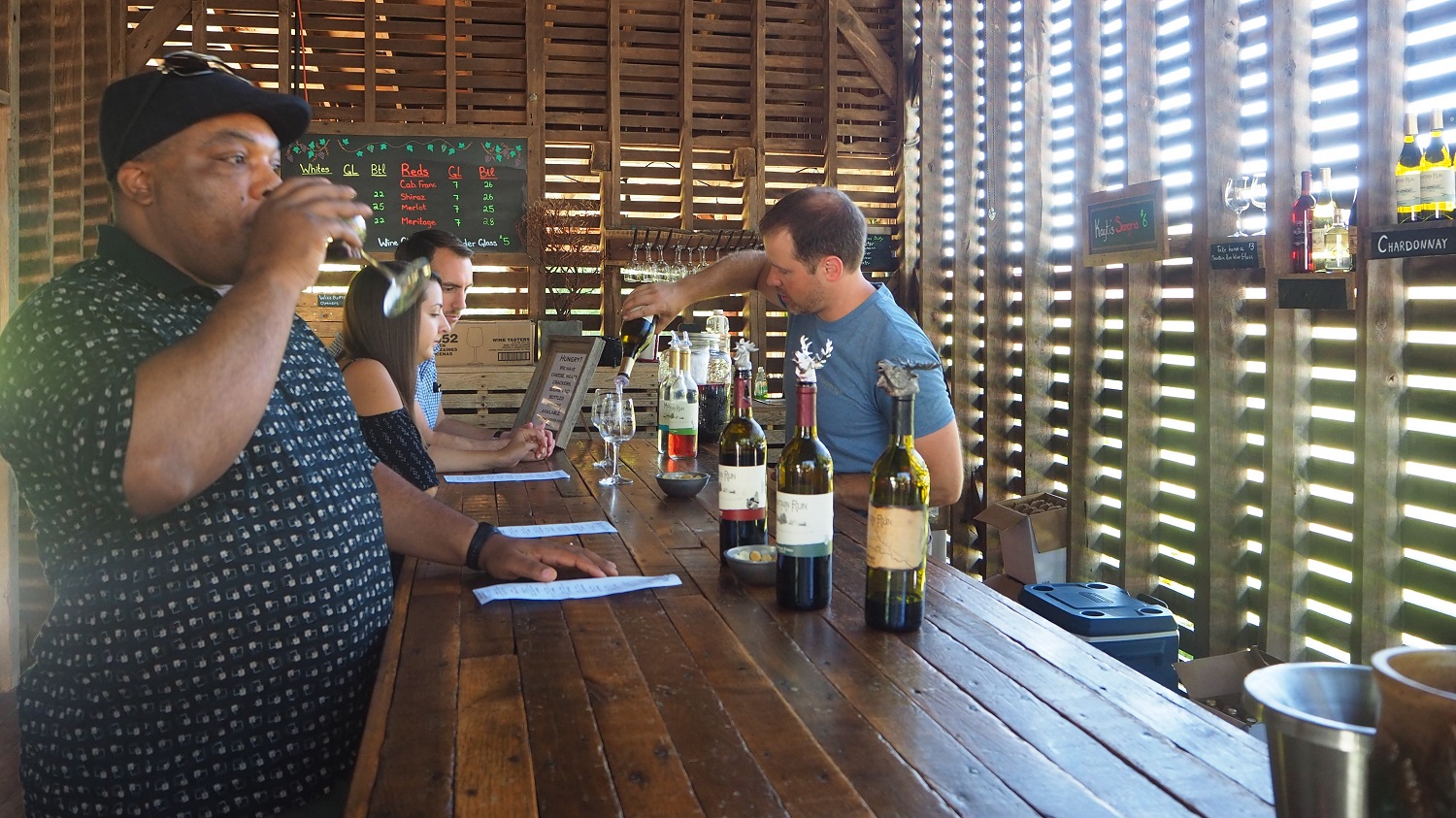 Dave in tasting room Pouring wines in the tasting room