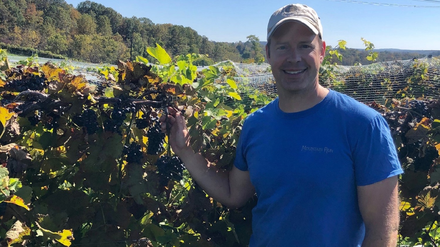 Our owner with fall grapes