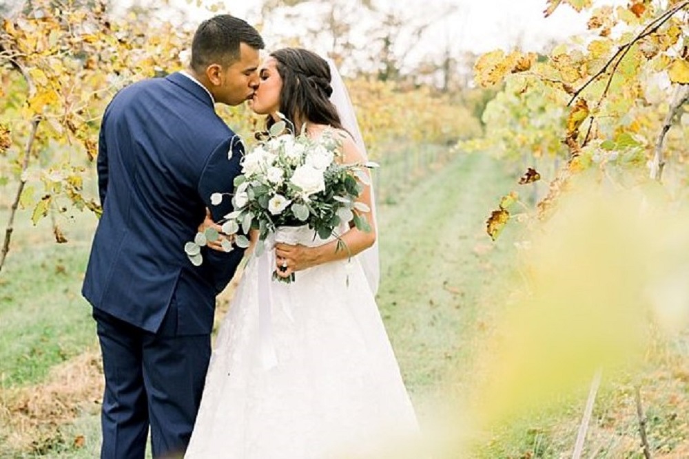 Wedding Look Book at Mountain Run Winery: couple kissing in vineyard