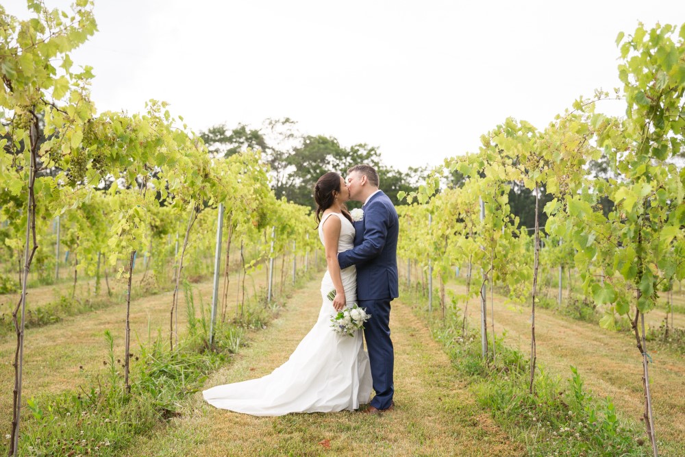 Wedding Look Book at Mountain Run Winery: couple kissing in vineyard