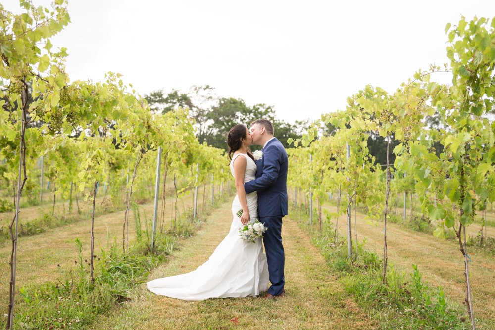 Weddings Wedding Look Book at Mountain Run Winery: couple kissing in vineyard