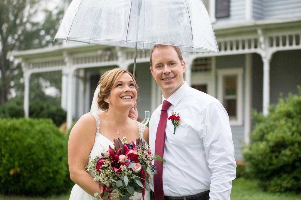 Wedding Look Book at Mountain Run Winery: Couple standing under umbrella