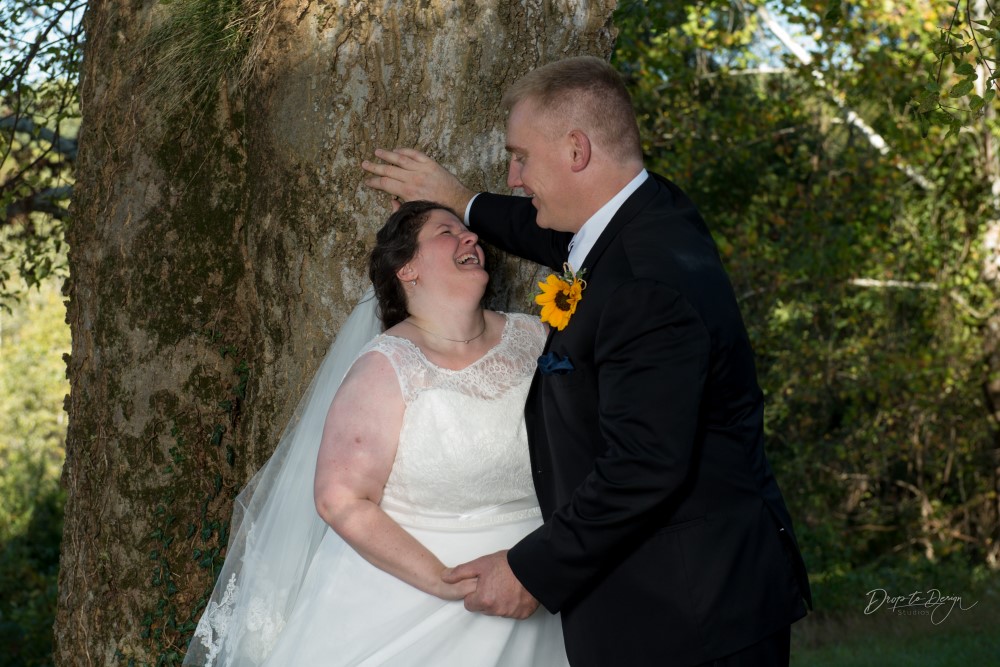 Wedding Look Book at Mountain Run Winery: Bride laughing under a tree