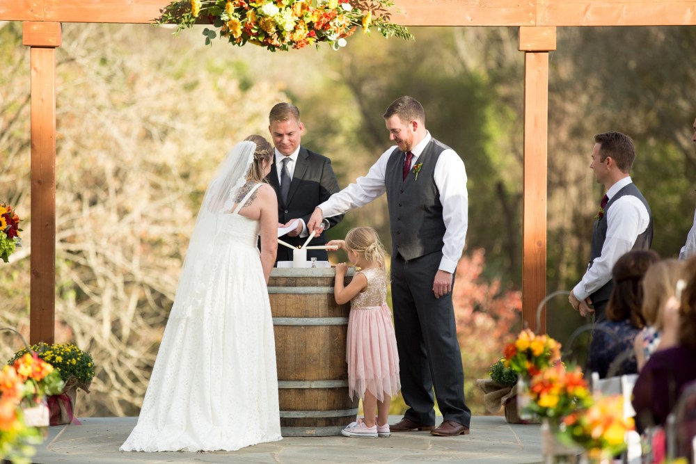 Weddings Wedding Look Book at Mountain Run Winery: Couple and daughter light unity candle