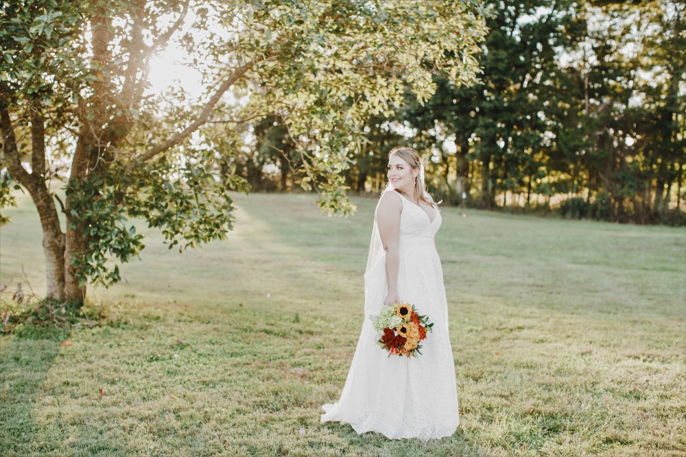 Wedding Look Book at Mountain Run Winery: Bride under a tree at sunset