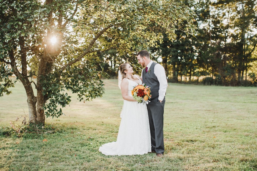 Wedding Look Book at Mountain Run Winery: Couple under tree at sunset
