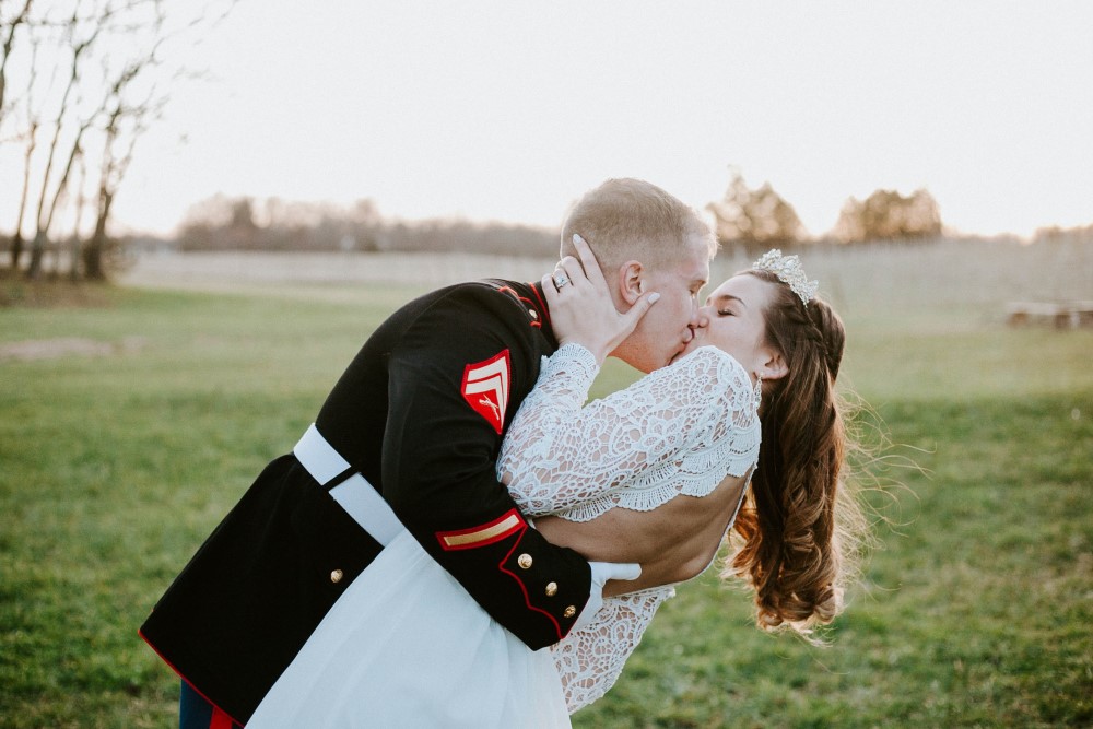 Wedding Look Book at Mountain Run Winery: Bride and military groom kissing