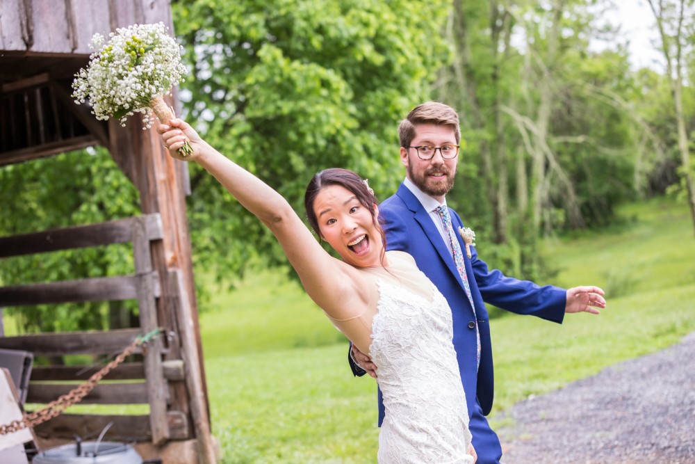 Wedding Look Book at Mountain Run Winery: Bride excited with groom smiling