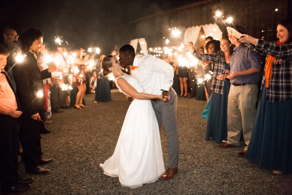 Weddings Wedding Look Book at Mountain Run Winery: Couple kissing with sparklers