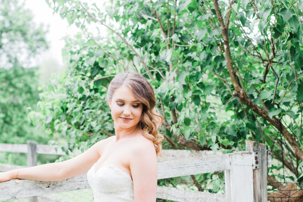 Weddings Wedding Look Book at Mountain Run Winery: Bride standing at fence
