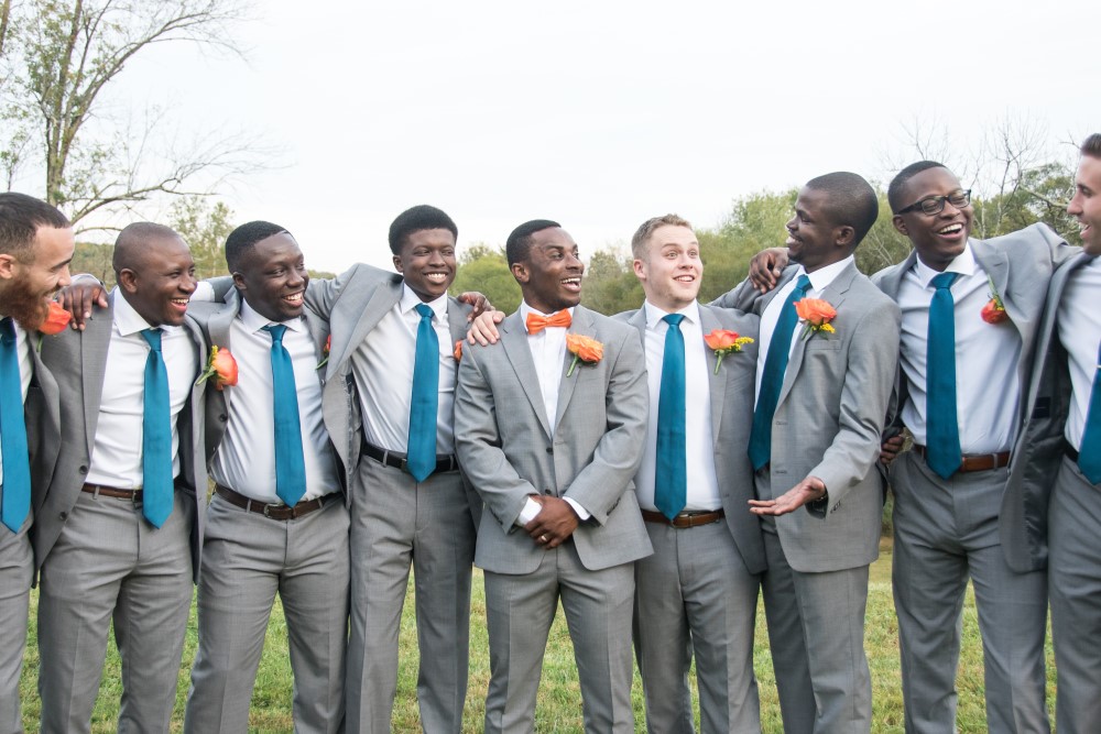 Wedding Look Book at Mountain Run Winery: groom party laughing