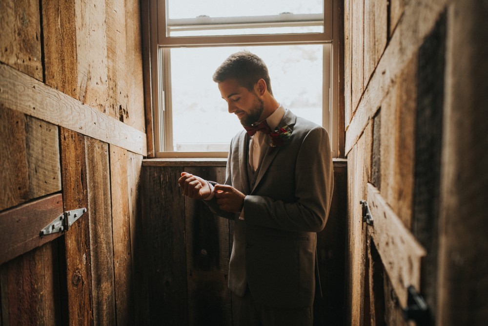 Wedding Look Book at Mountain Run Winery: Groom getting dressed