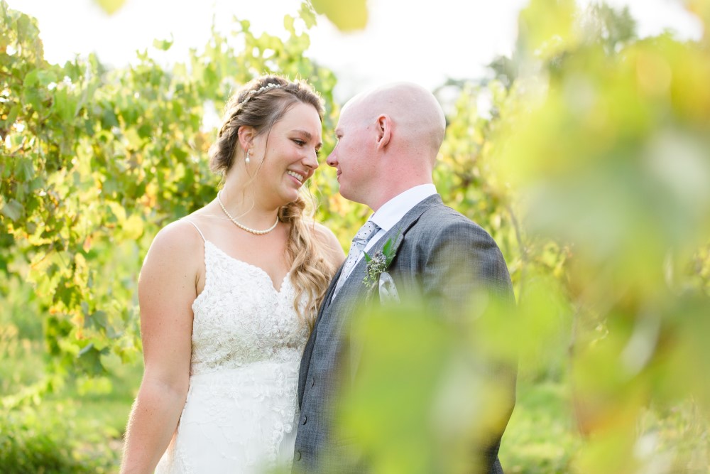 Weddings Wedding Look Book at Mountain Run Winery: Couple looking at each other in the vineyard