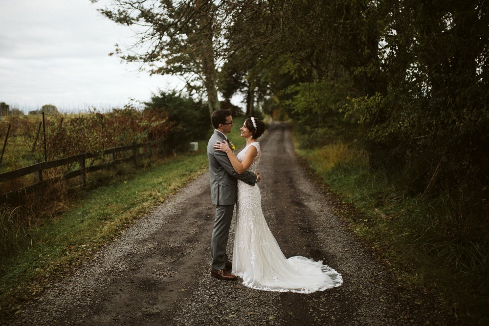 Weddings Wedding Look Book at Mountain Run Winery: Couple standing on gravel drive
