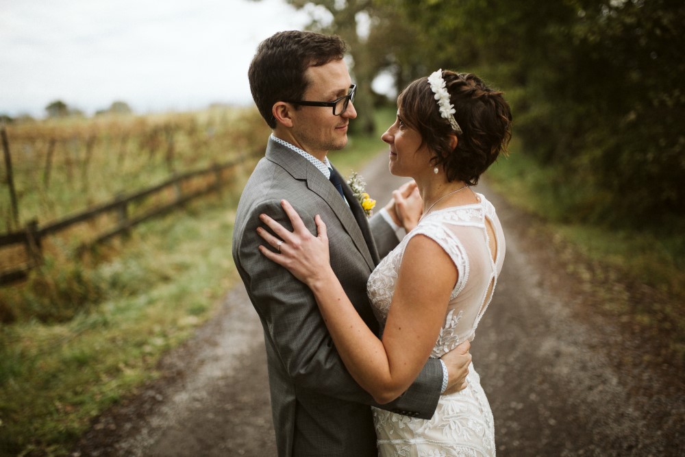 Wedding Look Book at Mountain Run Winery: Couple dancing on gravel drive