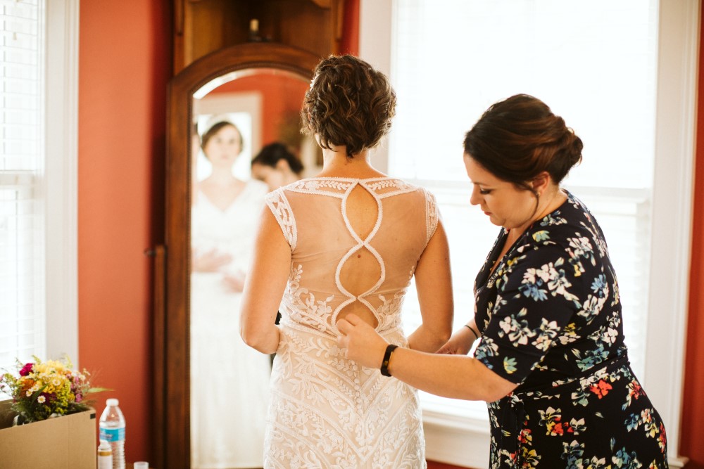 Wedding Look Book at Mountain Run Winery: Bride standing in front of a mirror