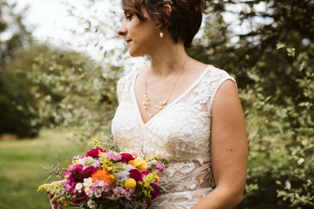 willandbecca618 Wedding Look Book at Mountain Run Winery: Bride with flowers