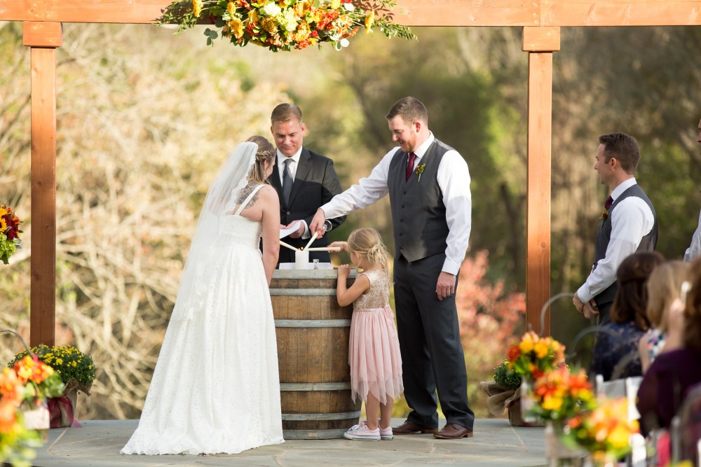 Wedding Look Book at Mountain Run Winery: Couple and daughter light unity candle