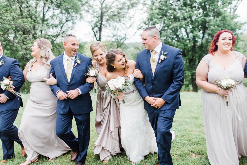 Wedding Look Book at Mountain Run Winery: Wedding party with bride laughing