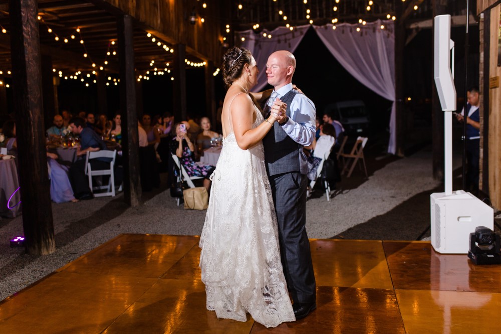 Wedding Look Book at Mountain Run Winery: Couple dancing in barn