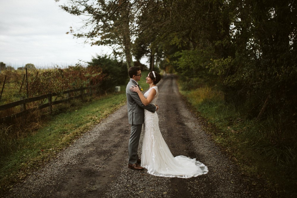 Wedding Look Book at Mountain Run Winery: Couple standing on gravel drive